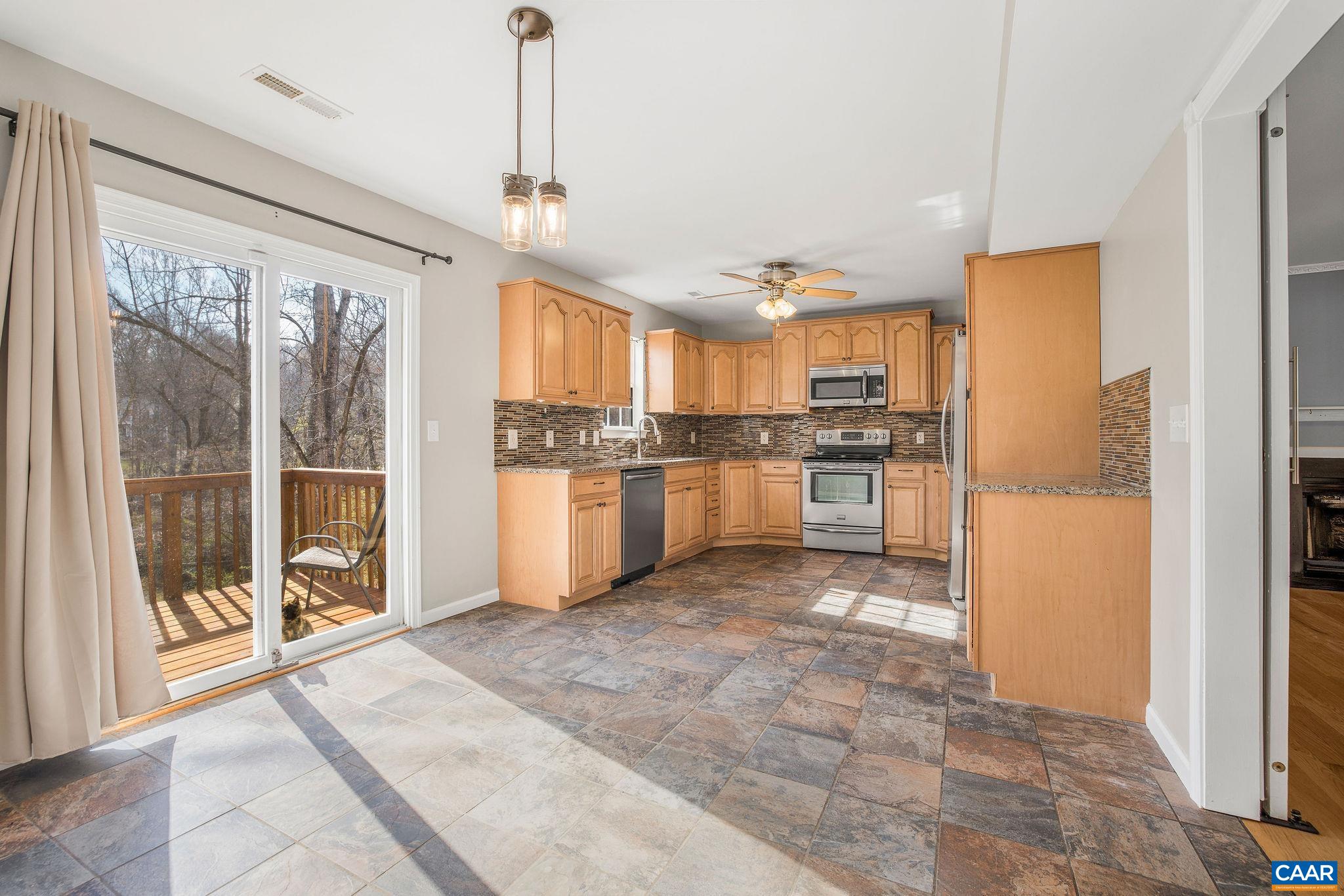 462 Fox Hunters Lane Madison, VA 22727 - Photo 17 of 65 a kitchen with stainless steel appliances granite countertop a refrigerator and a stove top oven