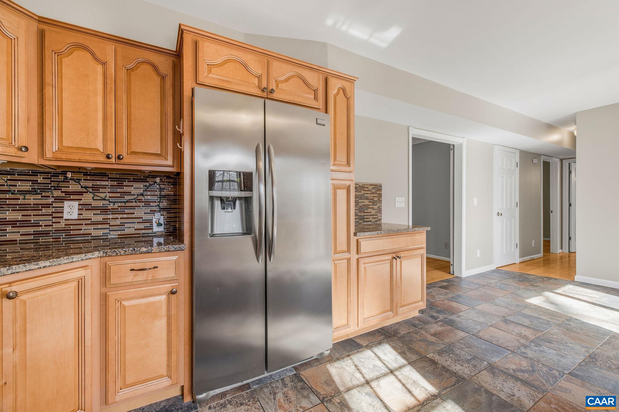 462 Fox Hunters Lane Madison, VA 22727 - Photo 19 of 65 a kitchen with stainless steel appliances granite countertop a refrigerator and a stove top oven
