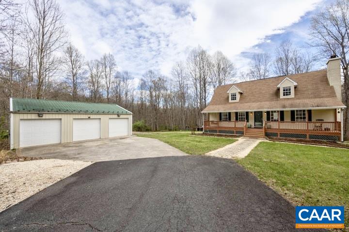 462 Fox Hunters Lane Madison, VA 22727 - Photo 2 of 65 a front view of a house with a yard and garage