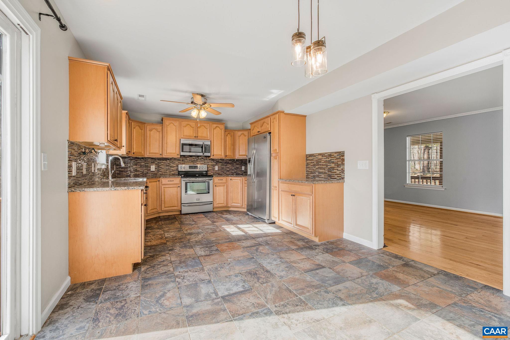 462 Fox Hunters Lane Madison, VA 22727 - Photo 24 of 65 a kitchen with stainless steel appliances granite countertop a refrigerator oven a sink and dishwasher