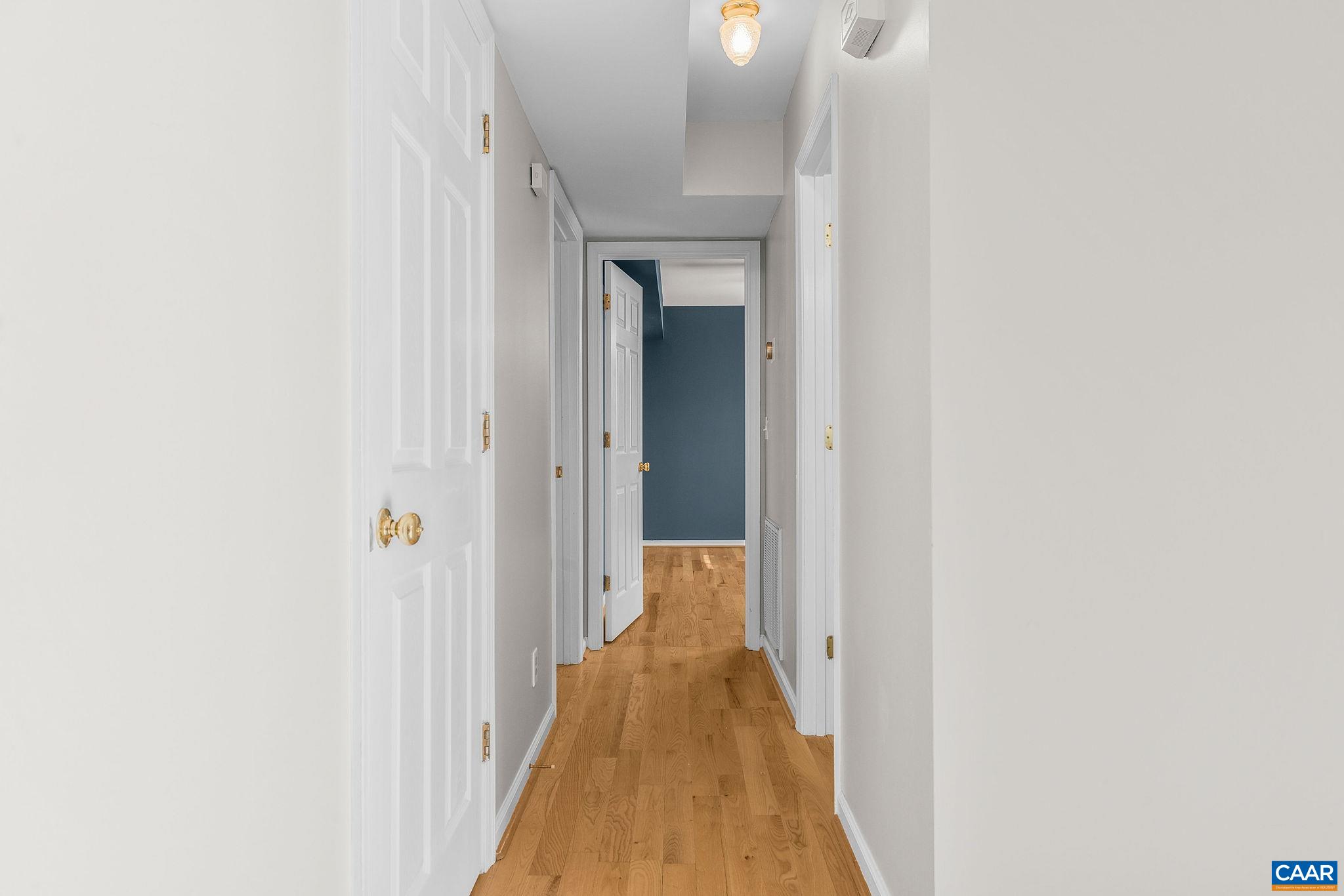 462 Fox Hunters Lane Madison, VA 22727 - Photo 27 of 65 a view of a hallway with wooden floor