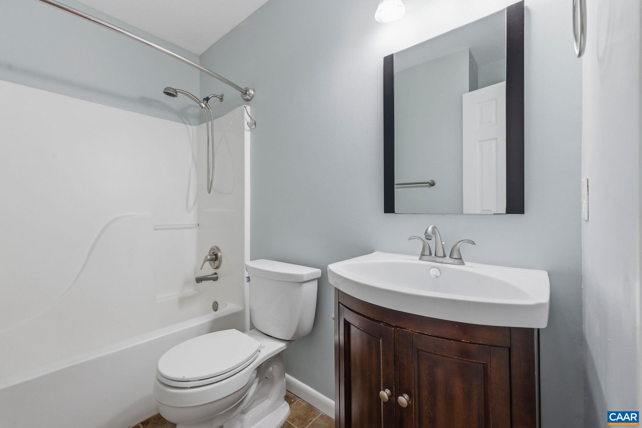 462 Fox Hunters Lane Madison, VA 22727 - Photo 33 of 65 a bathroom with a sink toilet vanity and shower
