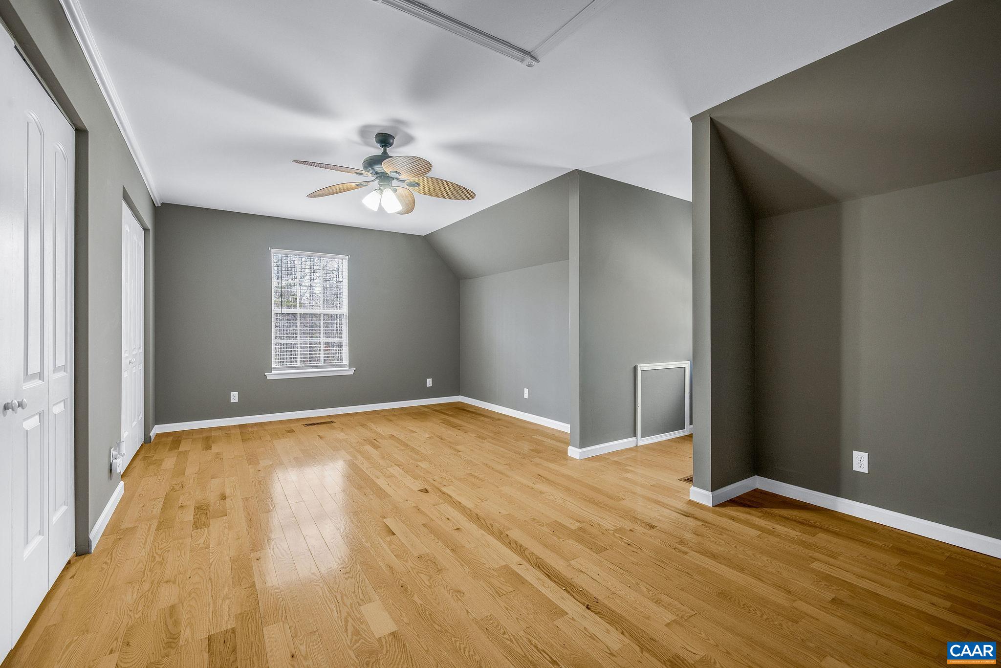 462 Fox Hunters Lane Madison, VA 22727 - Photo 35 of 65 a view of an empty room with window and wooden floor