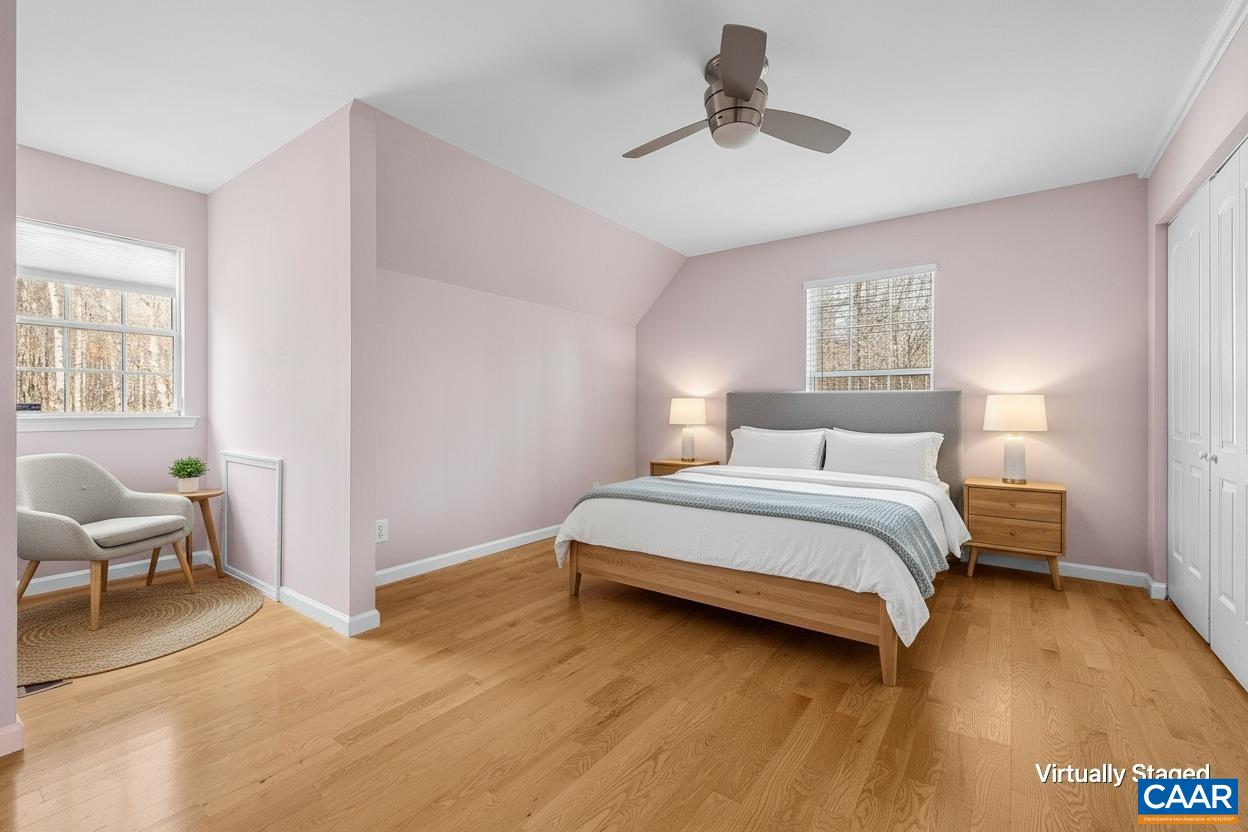 462 Fox Hunters Lane Madison, VA 22727 - Photo 39 of 65 a bedroom with a bed and a chandelier