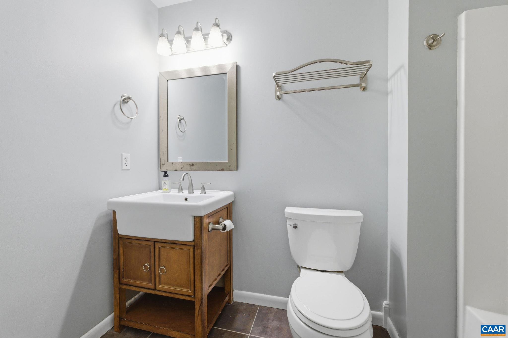 462 Fox Hunters Lane Madison, VA 22727 - Photo 40 of 65 a bathroom with a toilet a sink and a mirror