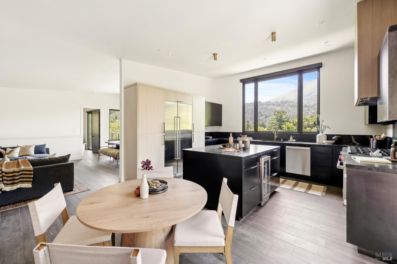 56 Millard Road Larkspur, CA 94939 - Photo 25 of 74 a kitchen with a dining table chairs and white appliances