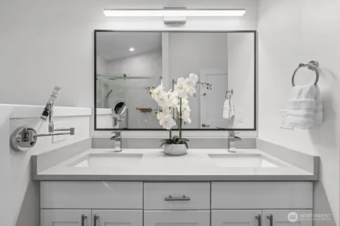 a bathroom with a sink and a mirror