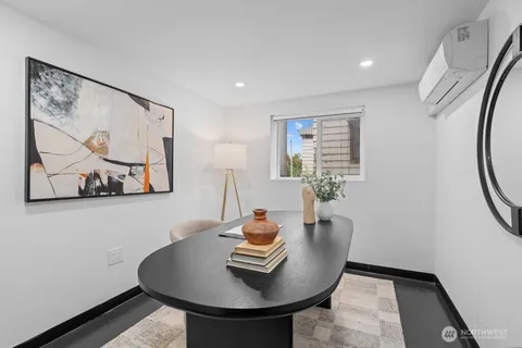 a dining room with furniture and window