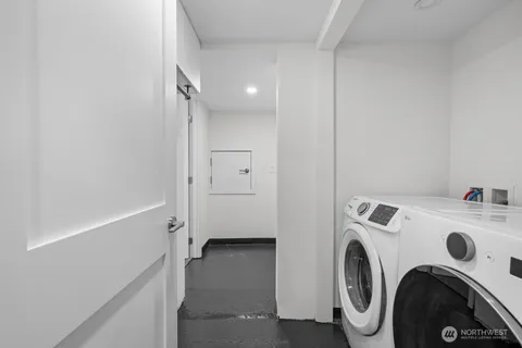 a view of storage and utility room with washer and dryer