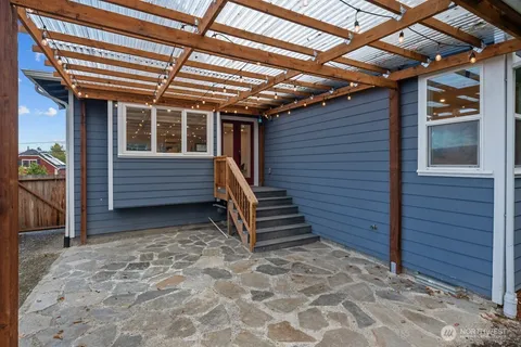 a view of a backyard with a wooden fence