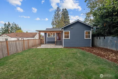a house view with a backyard space