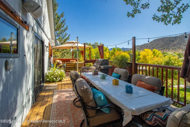 a outdoor space with patio the couches and a fireplace