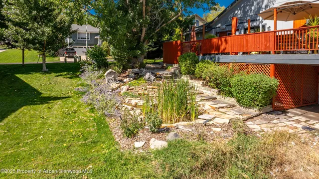 a backyard of a house with lots of green space