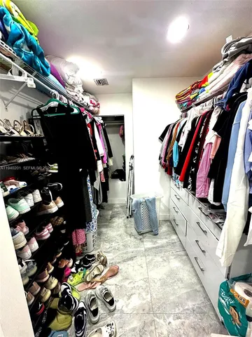 a view of a chairs and table in patio