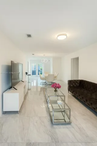 a living room with furniture and a couch