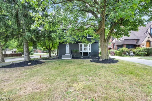 22790 Chardon Road Euclid, OH 44117 - Photo 10 of 35 View of property hidden behind natural elements with a front lawn