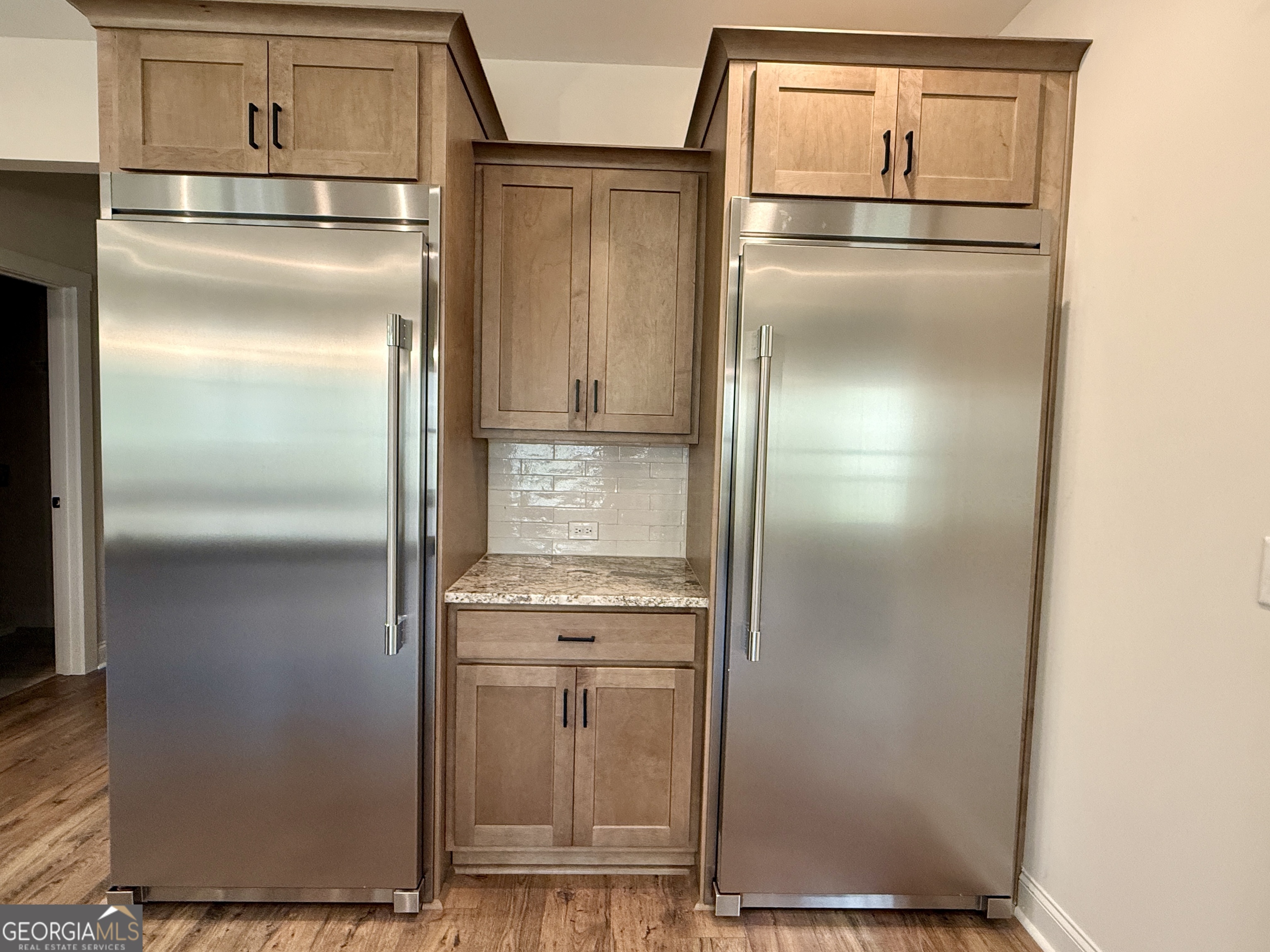 360 Indian Trail Concord, GA 30206 - Photo 17 of 67 a kitchen with metallic refrigerator freezer and a dishwasher