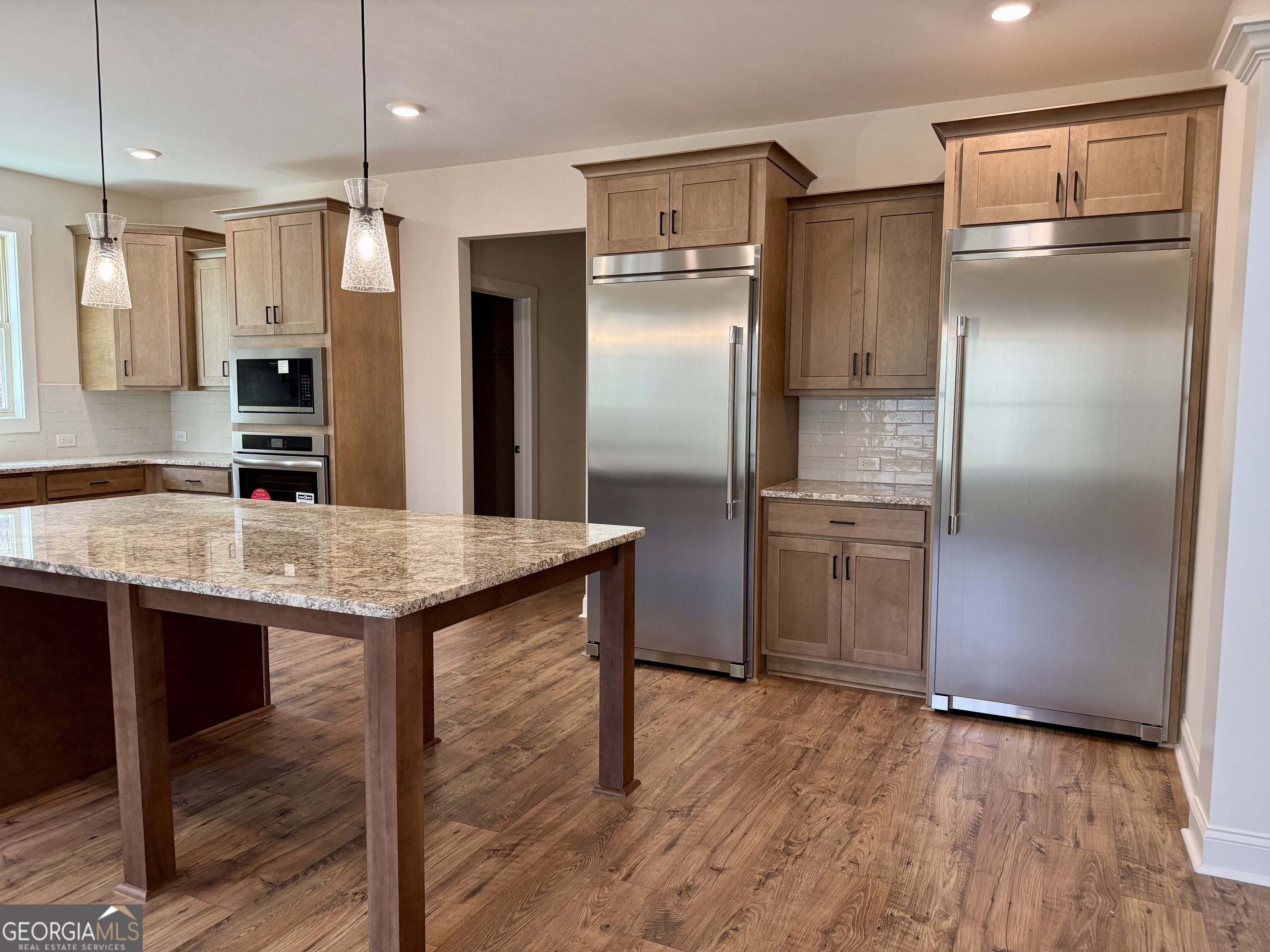 360 Indian Trail Concord, GA 30206 - Photo 18 of 67 a kitchen with stainless steel appliances a refrigerator and a sink
