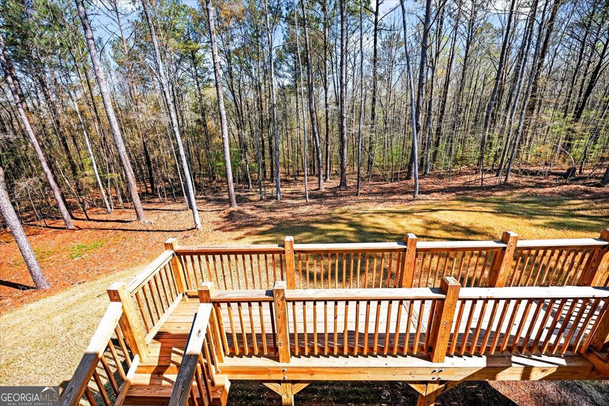 360 Indian Trail Concord, GA 30206 - Photo 28 of 67 a view of a chair and table on the deck