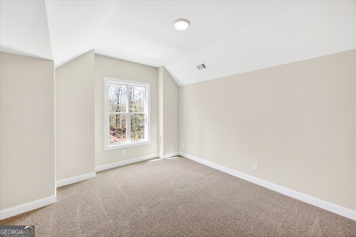 360 Indian Trail Concord, GA 30206 - Photo 30 of 67 a view of an empty room with a window