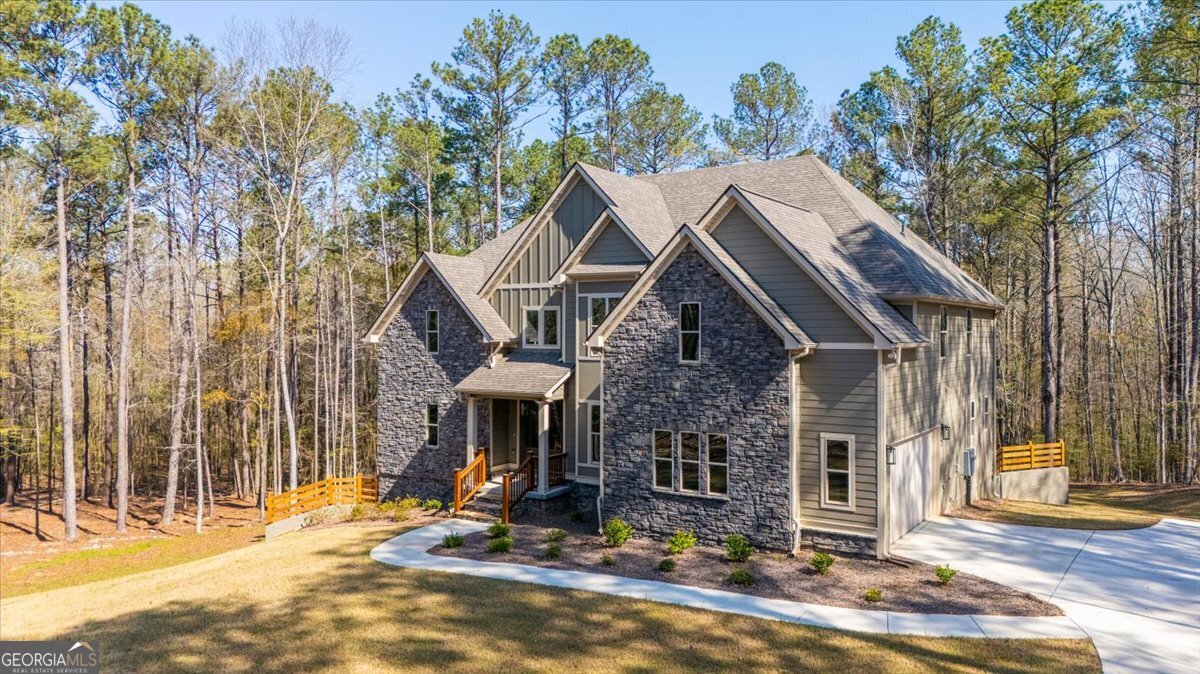 360 Indian Trail Concord, GA 30206 - Photo 3 of 67 a view of a house with backyard and trees