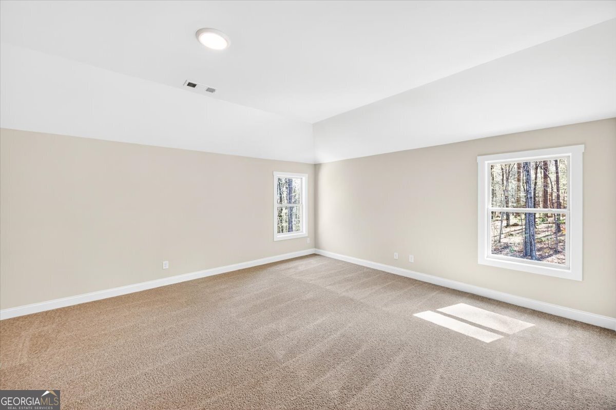 360 Indian Trail Concord, GA 30206 - Photo 32 of 67 an empty room with windows