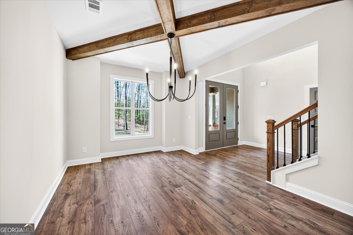 360 Indian Trail Concord, GA 30206 - Photo 7 of 67 a view of an entryway with wooden floor door and windows