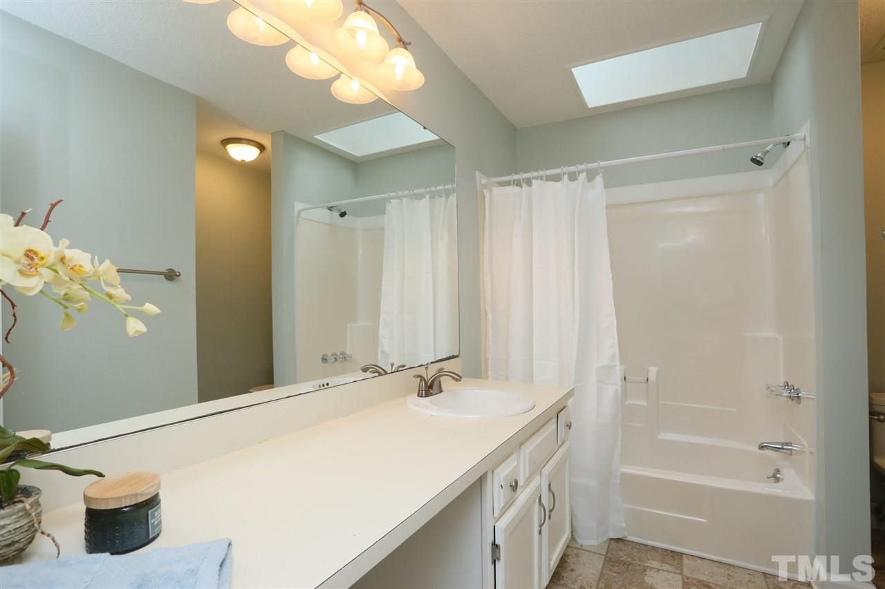 814 Temple Street Raleigh, NC 27609 - Photo 11 of 19 Bright and airy master bath has lots of counter space and a separate toilet area.