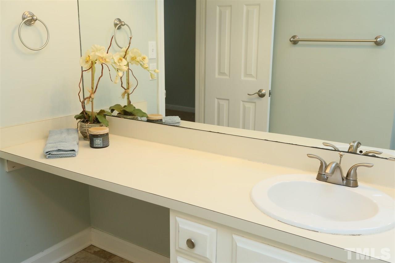 814 Temple Street Raleigh, NC 27609 - Photo 12 of 19 Bright and airy master bath has lots of counter space and a separate toilet area.