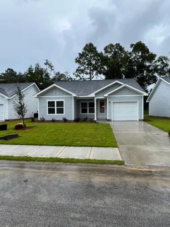a house with garden in front of it