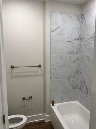 a bathroom with a white bath tub