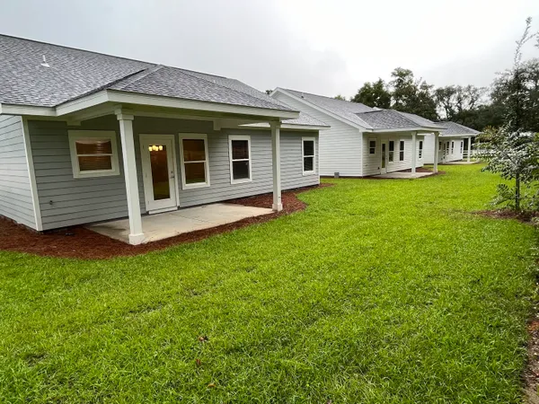 a view of a house with a backyard