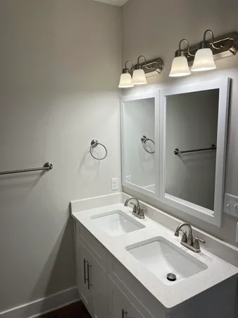 a bathroom with a sink and mirror