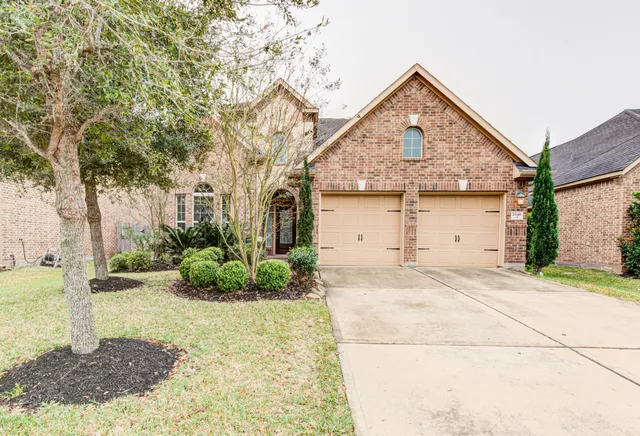 a view of a house with a street