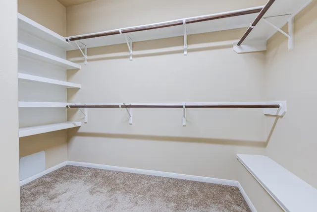 a view of an empty walk in closet