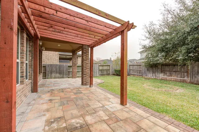 a view of a patio with a backyard