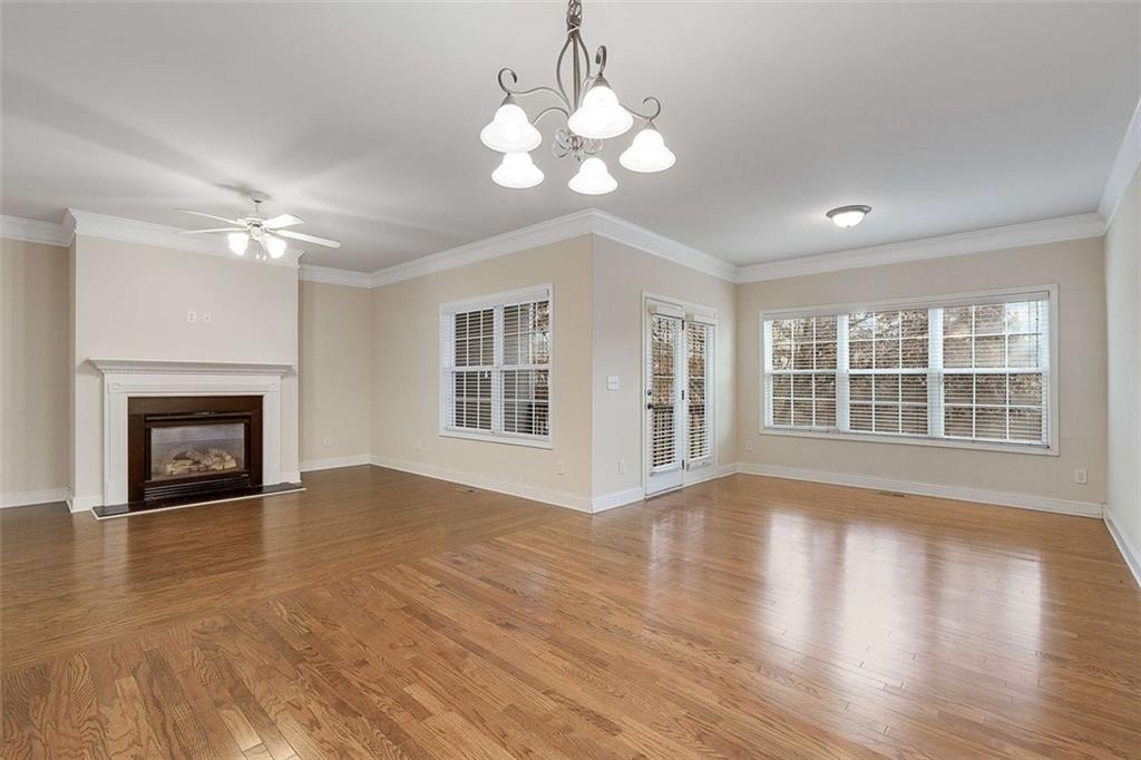 3199 Buck Way Alpharetta, GA 30004 - Photo 17 of 43 a view of an empty room with wooden floor and a fireplace