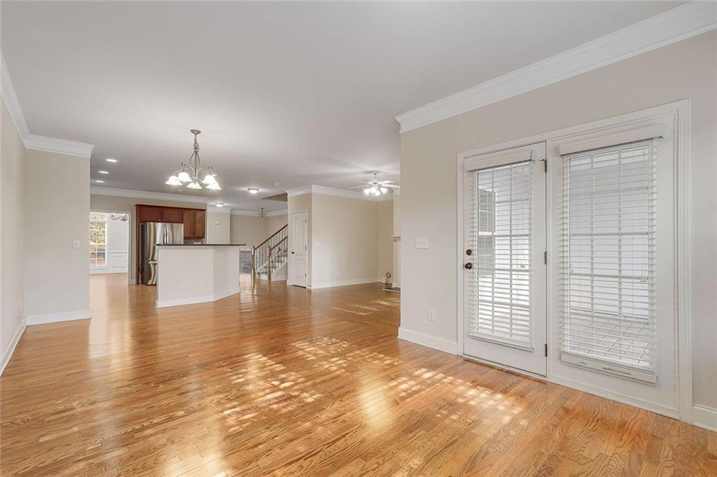 3199 Buck Way Alpharetta, GA 30004 - Photo 20 of 45 a view of a hallway with wooden floor and a kitchen