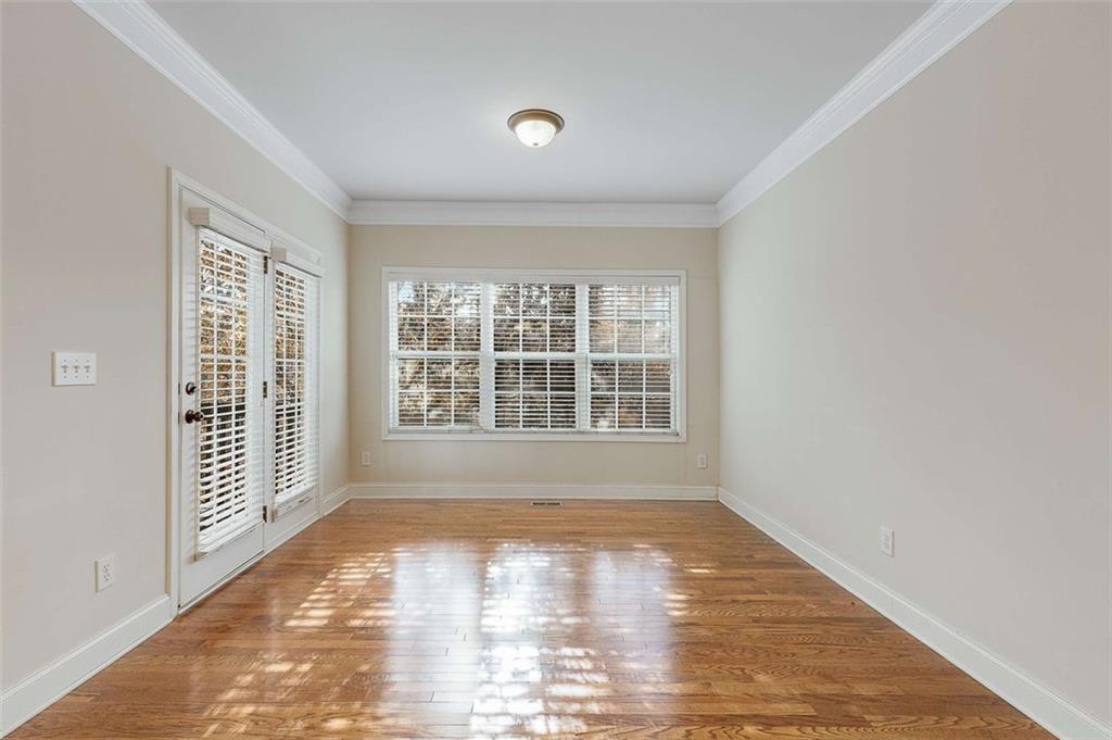 3199 Buck Way Alpharetta, GA 30004 - Photo 21 of 43 a view of an empty room with wooden floor and a window