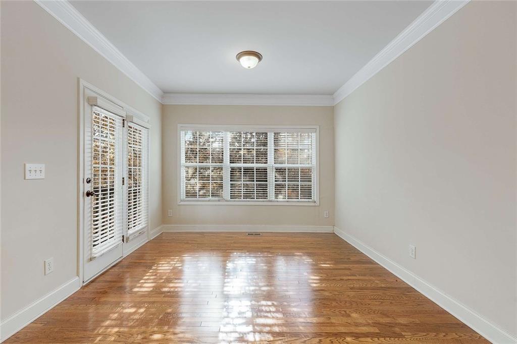 3199 Buck Way Alpharetta, GA 30004 - Photo 21 of 45 a view of an empty room with wooden floor and a window