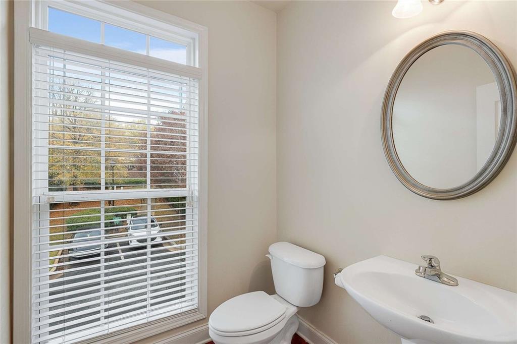 3199 Buck Way Alpharetta, GA 30004 - Photo 22 of 45 a bathroom with a toilet a sink and a mirror