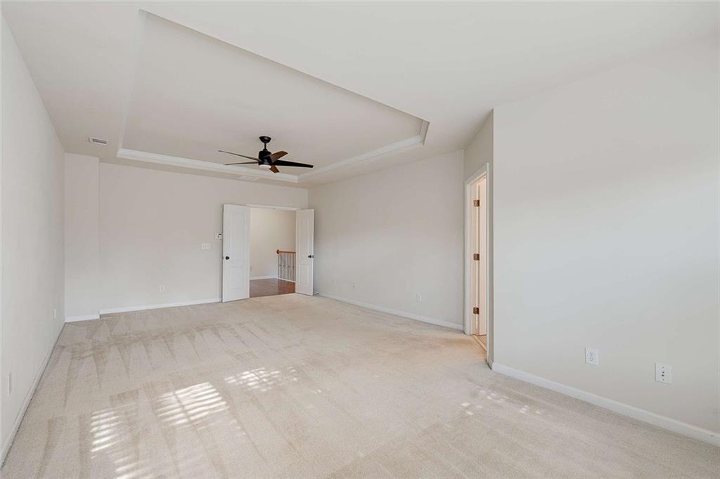 3199 Buck Way Alpharetta, GA 30004 - Photo 31 of 45 a view of a big room with closet and a ceiling fan