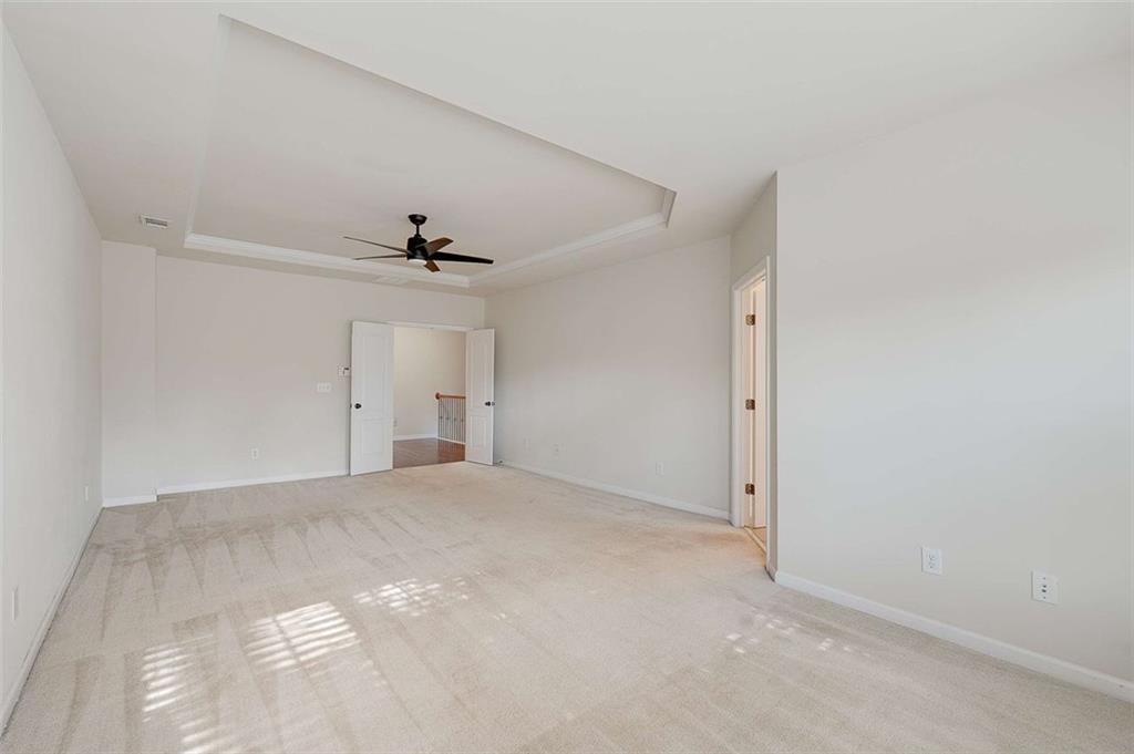 3199 Buck Way Alpharetta, GA 30004 - Photo 31 of 43 a view of a big room with closet and a ceiling fan
