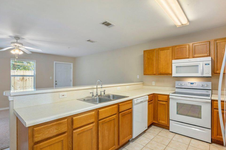 17 Southeast Shell Avenue, Unit B2 Fort Walton Beach, FL 32548 - Photo 4 of 8 a kitchen with a sink stove and microwave