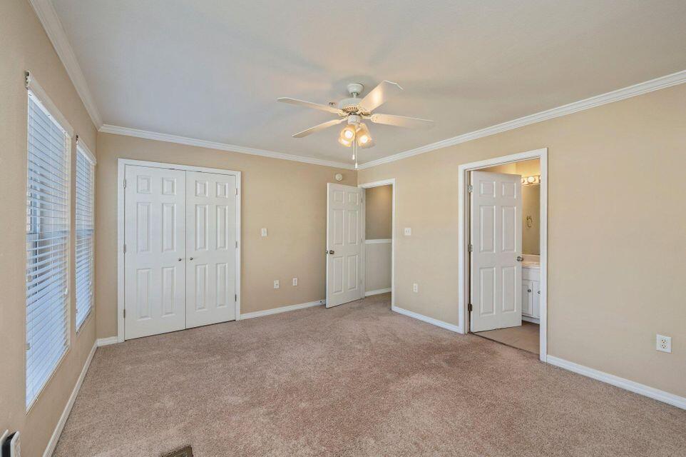 17 Southeast Shell Avenue, Unit B2 Fort Walton Beach, FL 32548 - Photo 6 of 8 a view of an empty room with a ceiling fan