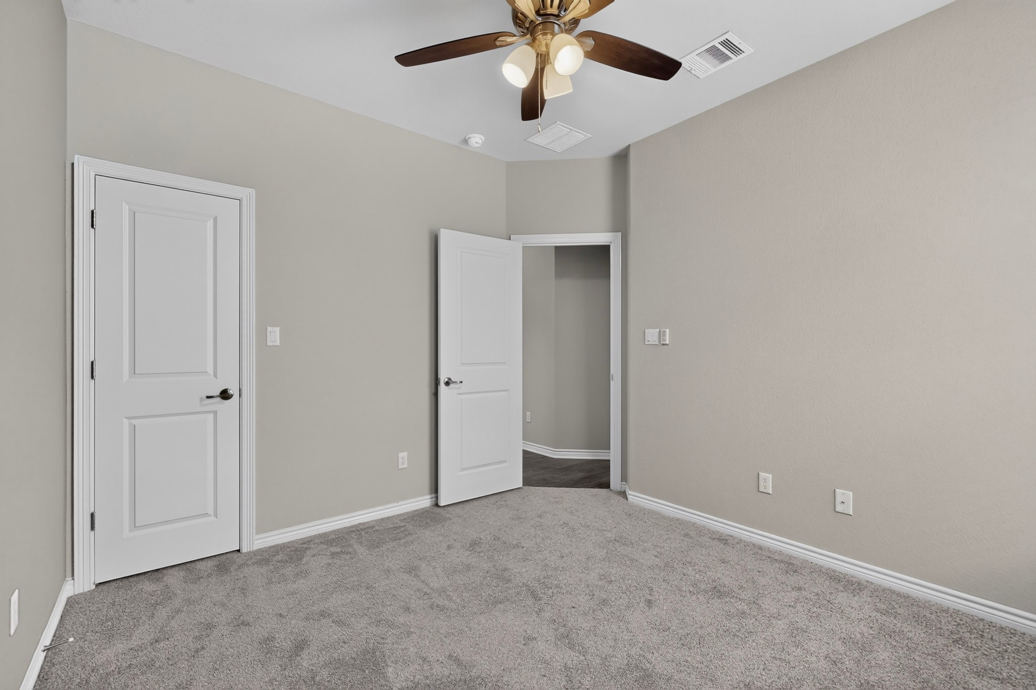 1908 Turtle Bay Loop Leander, TX 78641 - Photo 22 of 38 A versatile room featuring plush carpeting and a modern ceiling fan, ready for your personal touch.