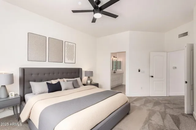 a kitchen with a sink a refrigerator and wooden floor