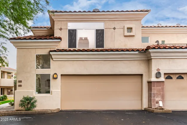 a view of a house with backyard porch and sitting area