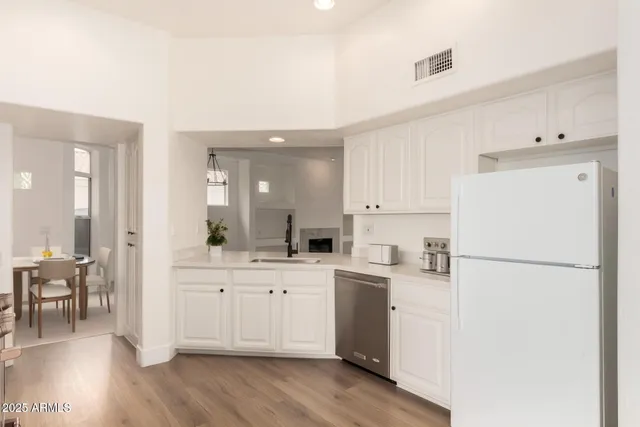 a view of a dining room with a table and chairs