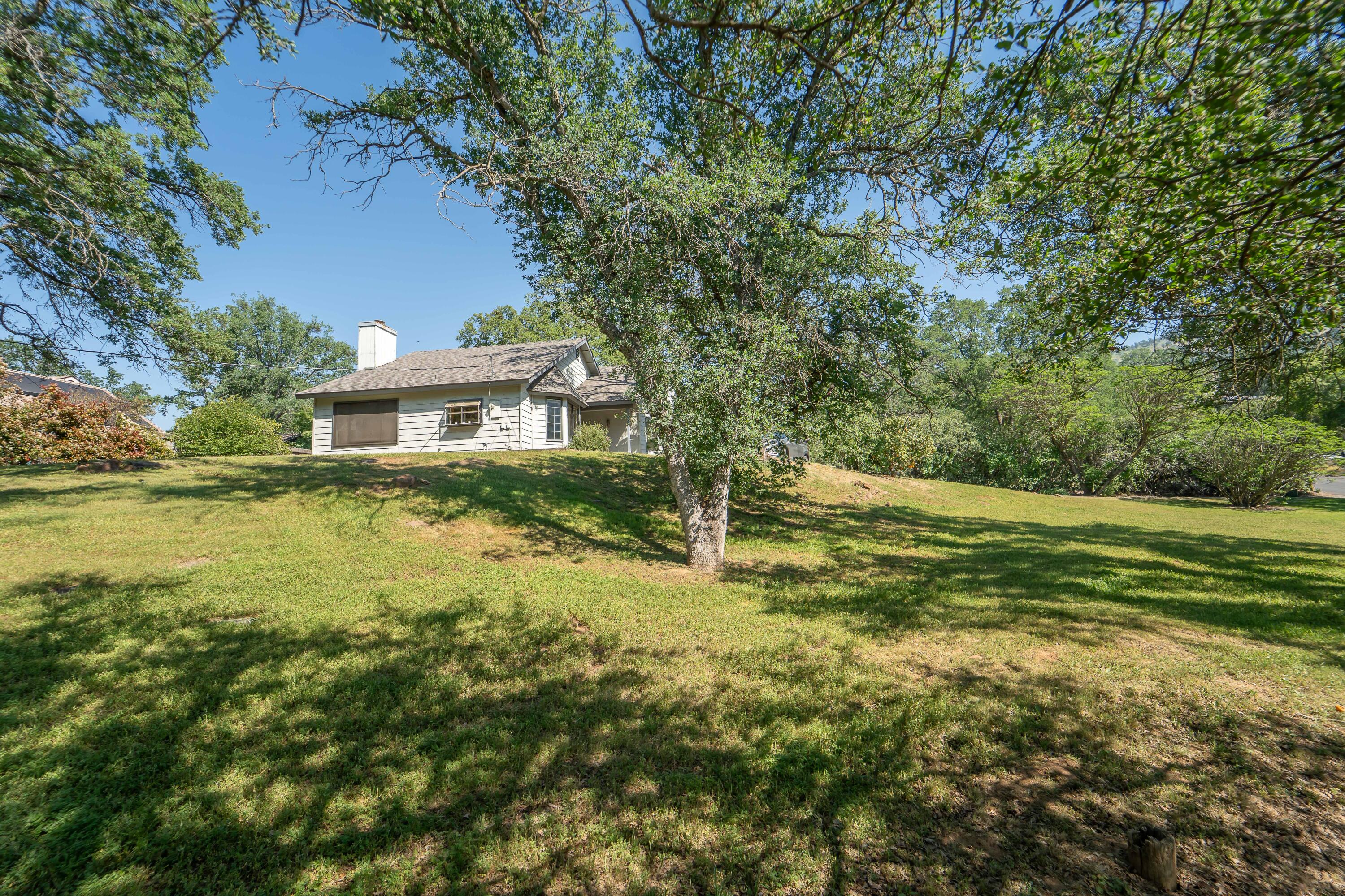 40962 Oak Ridge Drive Three Rivers, CA 93271 - Photo 2 of 36 a view of a house with a yard